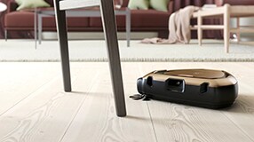 Robot vacuum cleaner i action on floor